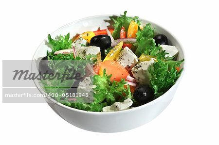 Appetizing greek salad with feta cheese in a bowl. Isolated on white