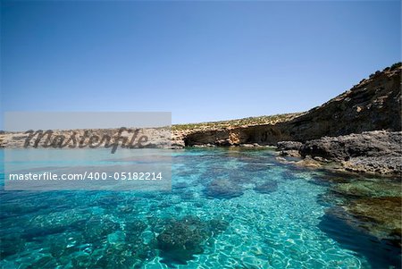 Crystal clear waters of the Blue Lagoon located on the island of Comino in Malta.