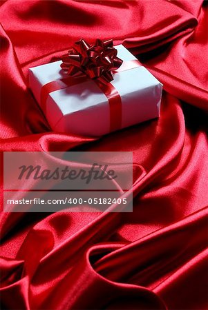 gift box on red satin background