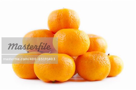 Fresh juicy tangerines on white background.