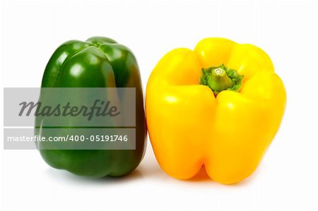 Fresh yellow and green peppers isolated on white
