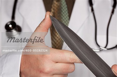 Doctor with Stethoscope Holding A Very Large Knife.