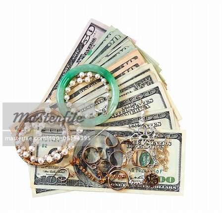 Money and jewelry isolated on white background