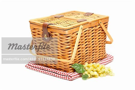 Picnic Basket, Grapes and Folded Blanket Isolated on a White Background.