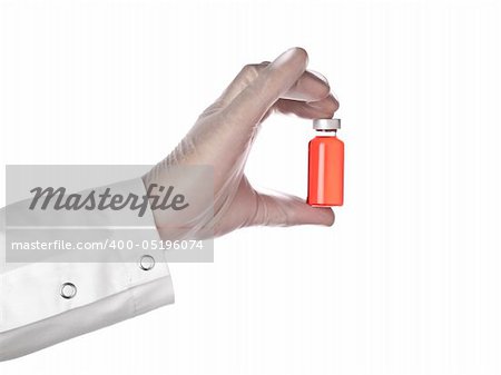 A doctor holds a vial full of red liquid with his latex gloves on. Isolated on white.