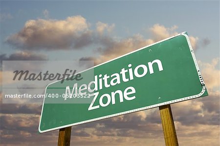 Meditation Zone Green Road Sign In Front of Dramatic Clouds and Sky.