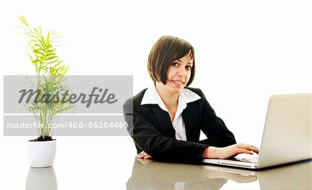 one young business woman isolated on white working on laptop computer