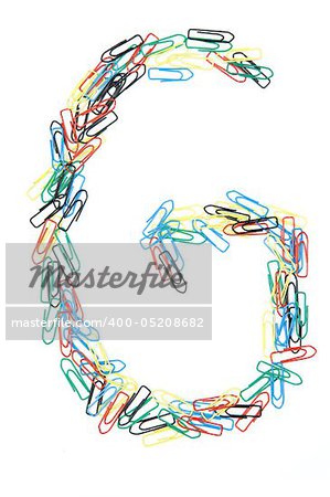 Letter G formed with colorful paperclips