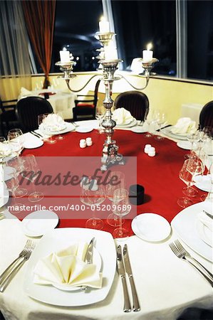 setting of empty dishes in luxury restaurant and table