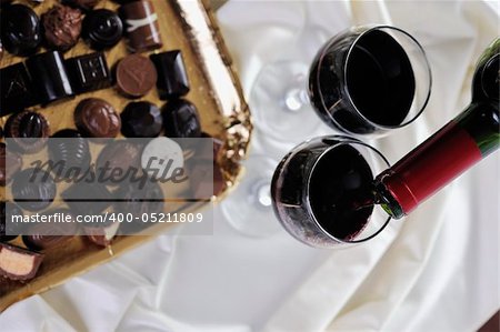 luxury and sweet praline and chocolate with wine bottle and glasses  decoration