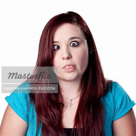 Young woman makes a funny face, crossing eyes