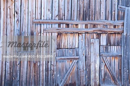 Wooden wall old country barn with a window and door