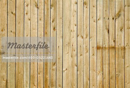 Wall covered with rough pine boards - a wooden background
