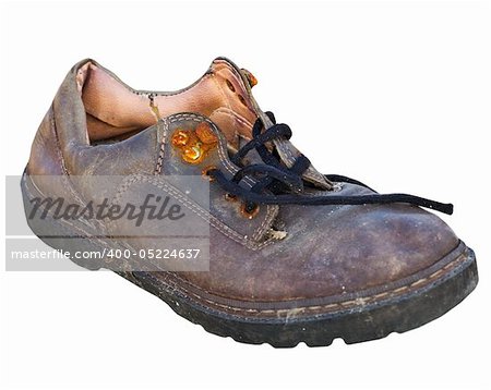 Old worn-out rotten shoe isolated on white background