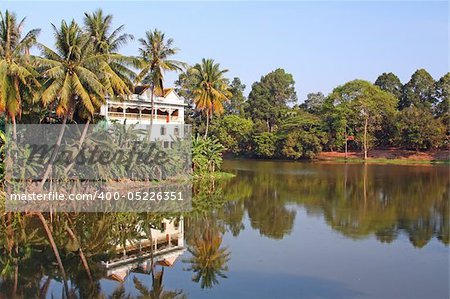 Waterfront villa at at the edge of a scenic tropical lake