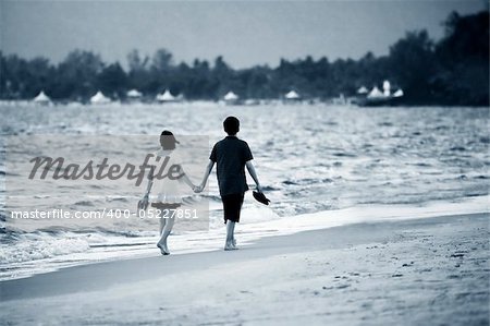 Couple on sunset. Coast of the Indian ocean