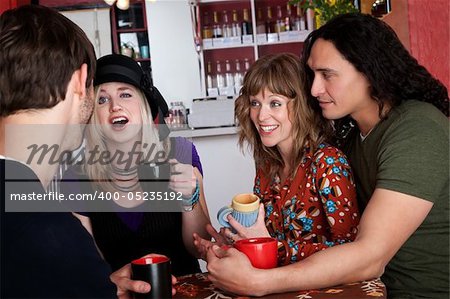 Couples and good friends chat in a cafe