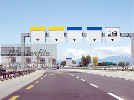 Perspective view from car on a motorway approaching a toll booth