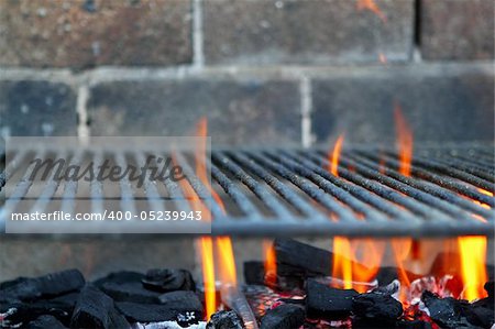 Bar b cue barbecue fire BBQ coal fire iron grill brick wall