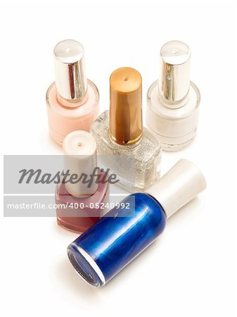 bottles with nail polish on a white background