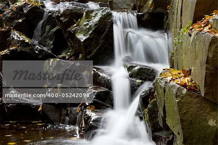 Small waterfall with wet rocks