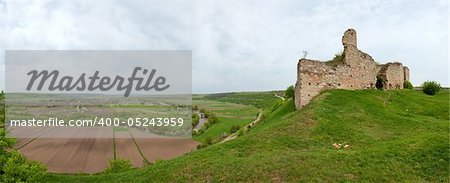 Spring view of Chernokozinetsky castle  ruins (Chernokozintsy village , Kamyanets-Podilsky region, Khmelnytsky Oblast, Ukraine). Built in second half of XIV th century. Six shots stitch image.
