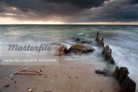 groyne with heavy clouds