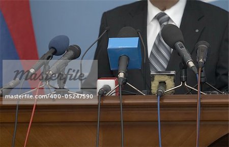 close up of conference meeting microphones