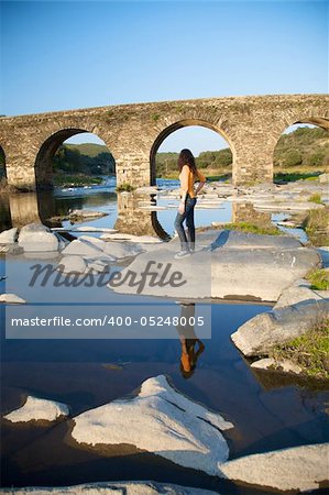 ancient stone bridge on a river in salamanca spain