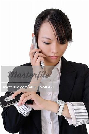Busy business woman holding cellphones and watching watch, closeup portrait on white background.