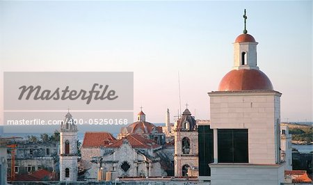 Old havana skyline with morro fortress in the background at sunset