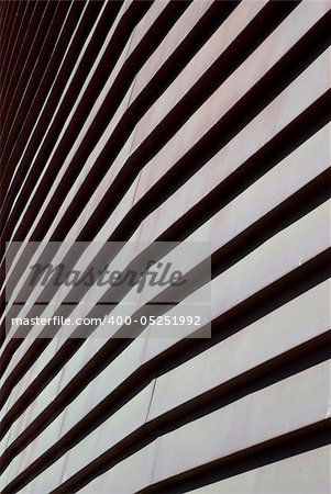 Abstraction of curves for modern building on a clear blue sky.