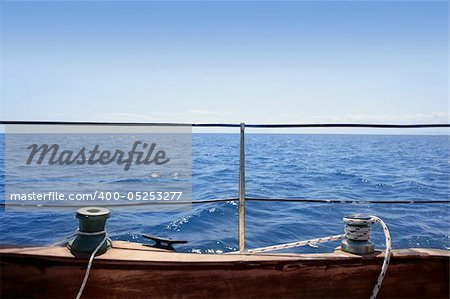 sailboat winches wooden board blue sea horizon summer vacation