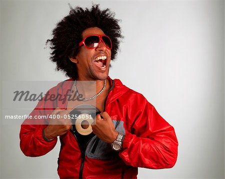 Hiphop artist posing with a vinyl record