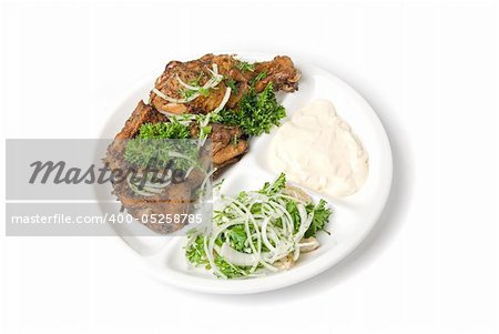 meat with sauce and vegetables isolated on white background