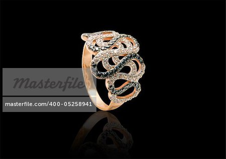 Beauty gold ring with diamond gems on black background