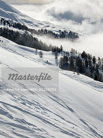 Mountain landscape with clouds and snow