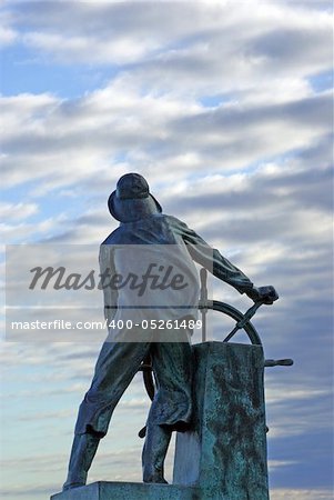 Fisherman's Memorial stands tall overlooking the harbor.