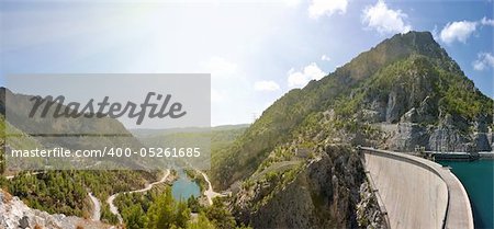 mountain canyon and hydroelectric dam panorama under sky