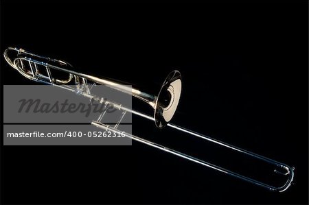 A complete trombone Isolated against a black background in the Horizontal format.