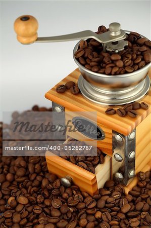 an old-fashioned wooden coffee grinder