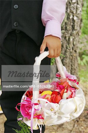 Wedding, basket of petals and boy, outdoor,