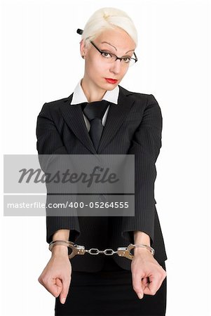 Young beautiful business woman with handcuffs on her hands. Isolated over white background.