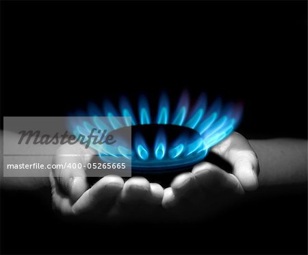 Hands holding a flame gas