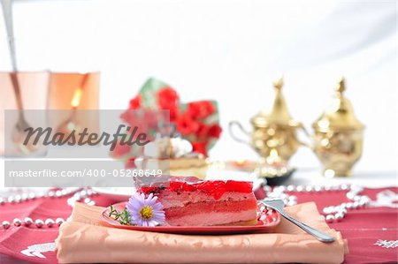 Fruit dessert with tea and roses