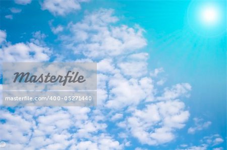 Beautiful cloudy blue sky with bright sun