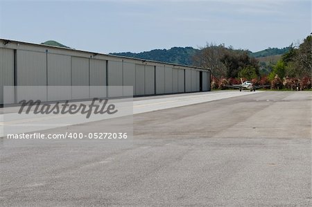 Row of airplane hangers, South County Airport, San Martin, California