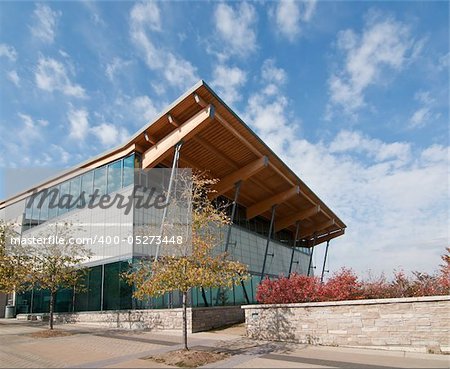 A modern community center building housing a swimming pool.