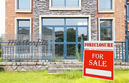 Foreclosure on Home for Sale sign in front yard