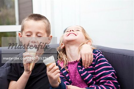 Happy Siblings eating ice-cream